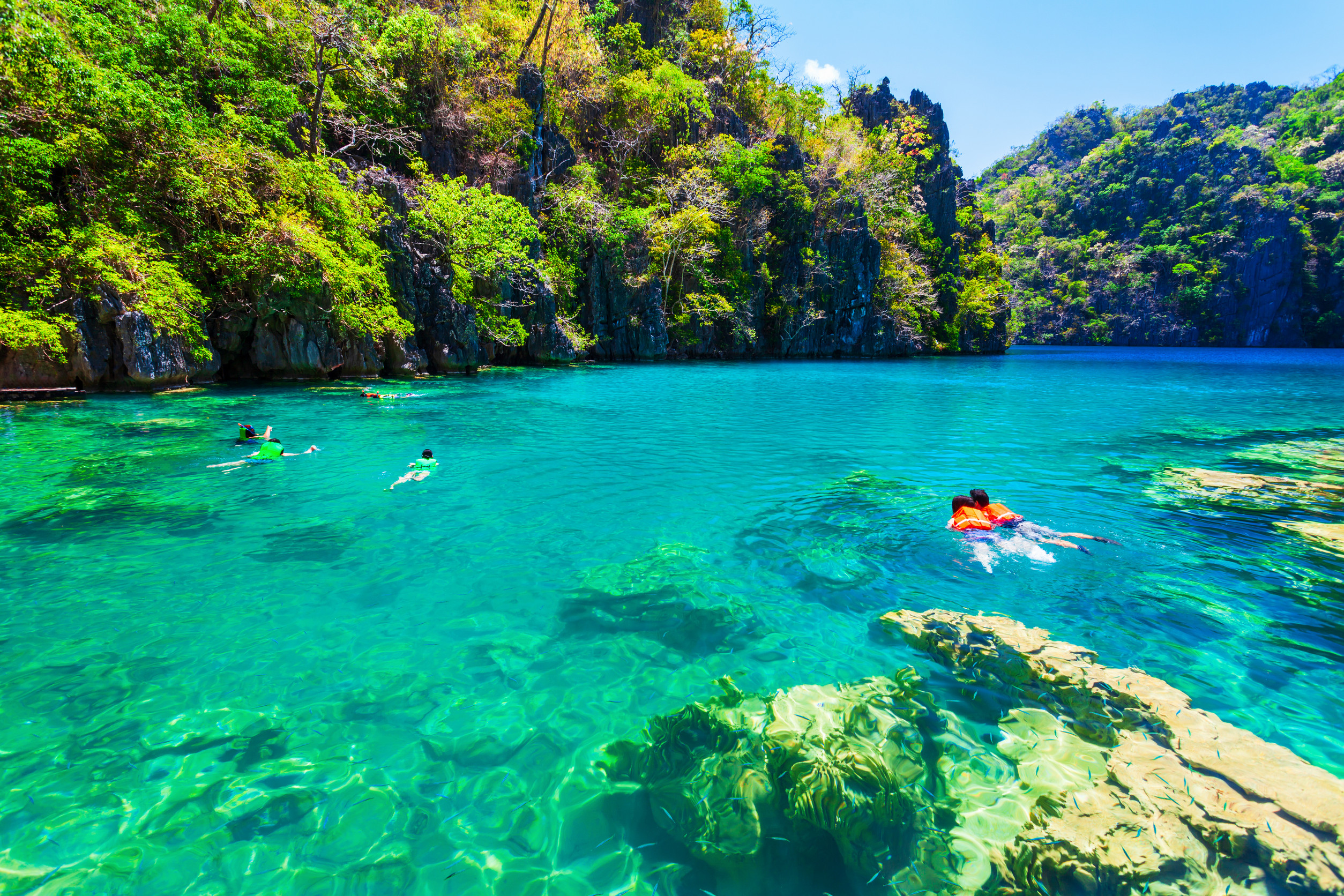 Tourists enjoy on Barracuda Lake in Coron Island, Philippines