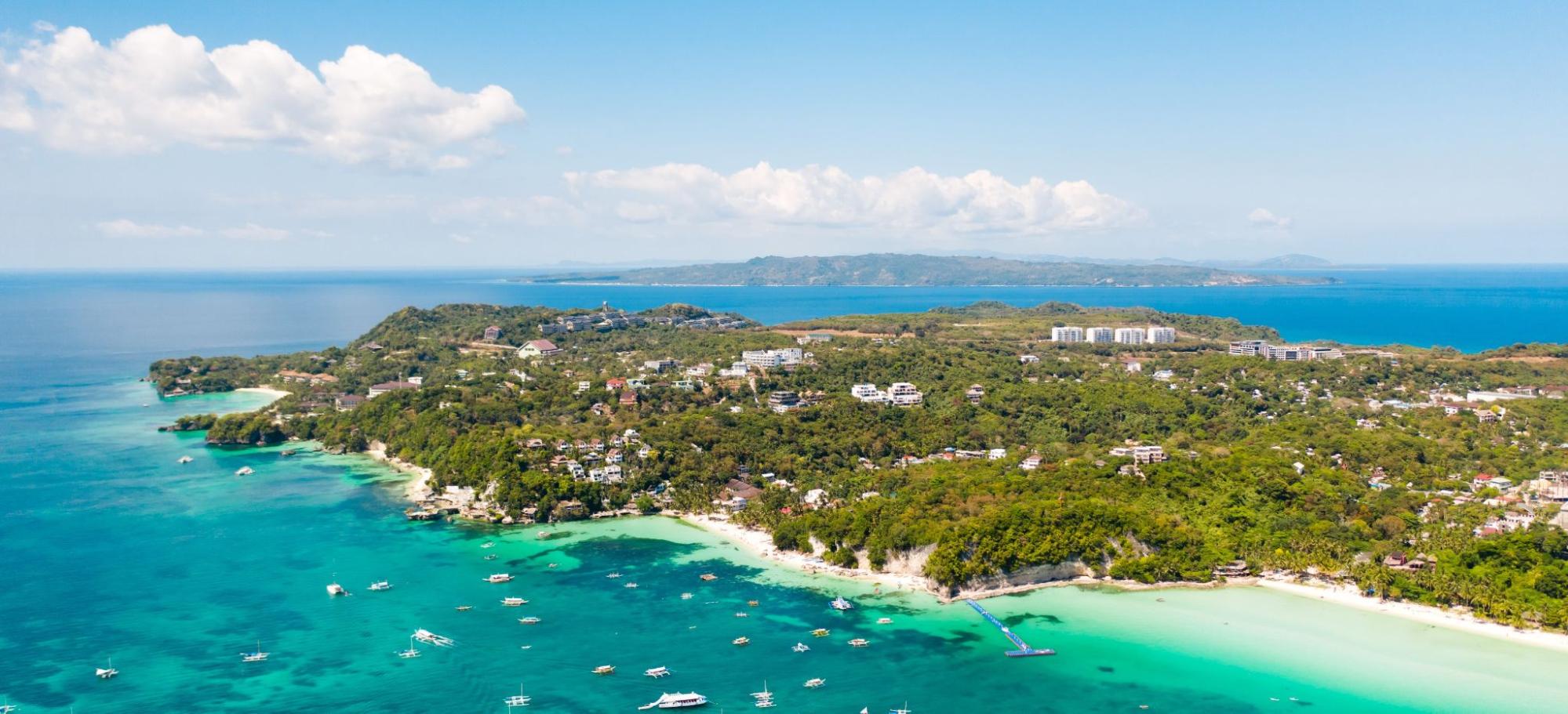 Tourist boats off the coast of the island of Boracay, Philippines